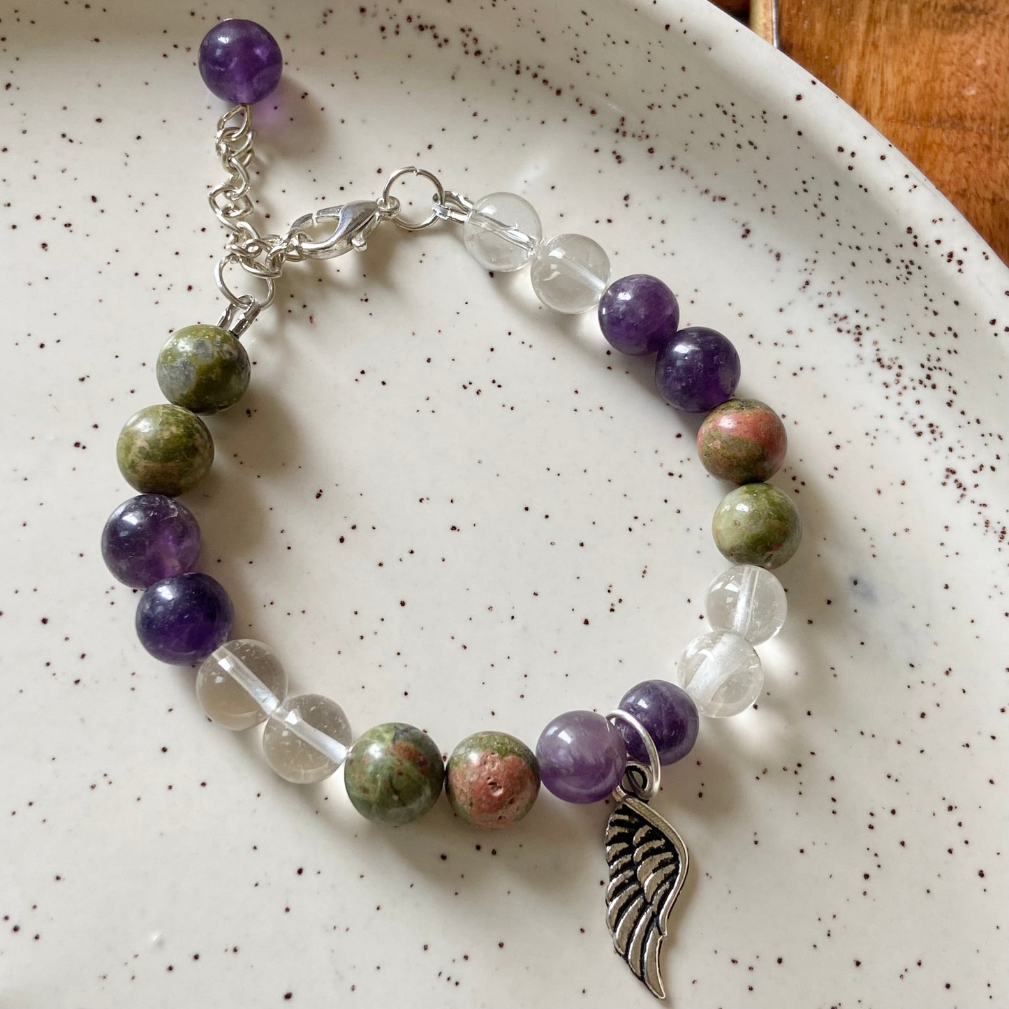 Bracelet associated with Personal Growth and overall healing | Unakite, Amethyst & Clear Quartz with angel wing charm