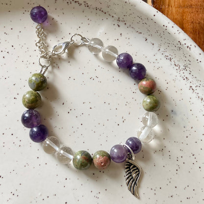 Bracelet associated with Personal Growth and overall healing | Unakite, Amethyst & Clear Quartz with angel wing charm