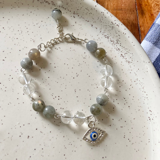 Bracelet associated with Growth & Transformation | Labradorite & Clear Quartz with evil eye charm