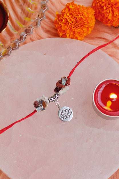 Mix Chips Crystal Rakhi with Lotus Charm